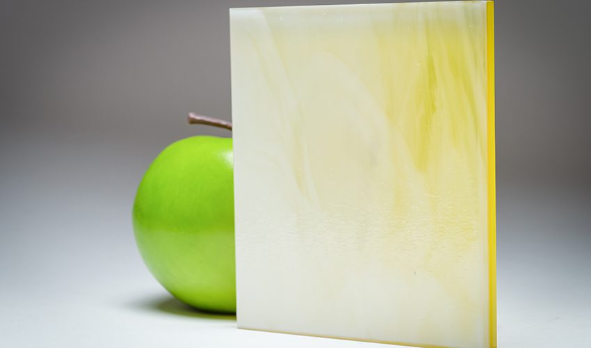 A feature image of the citrus and cream marbled custom laminated glass MX-5315, crafted by Archetype Glass for the Q2 2022 QSP
