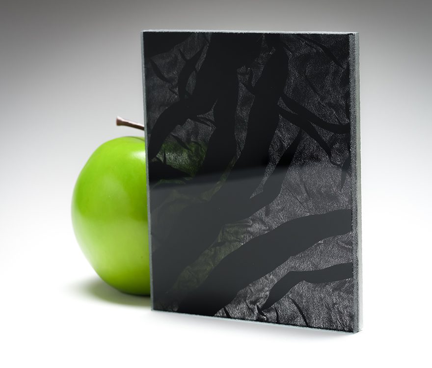 A nearly fully opaque sample of laminated fabric glass featuring custom fabric from Spatial Element